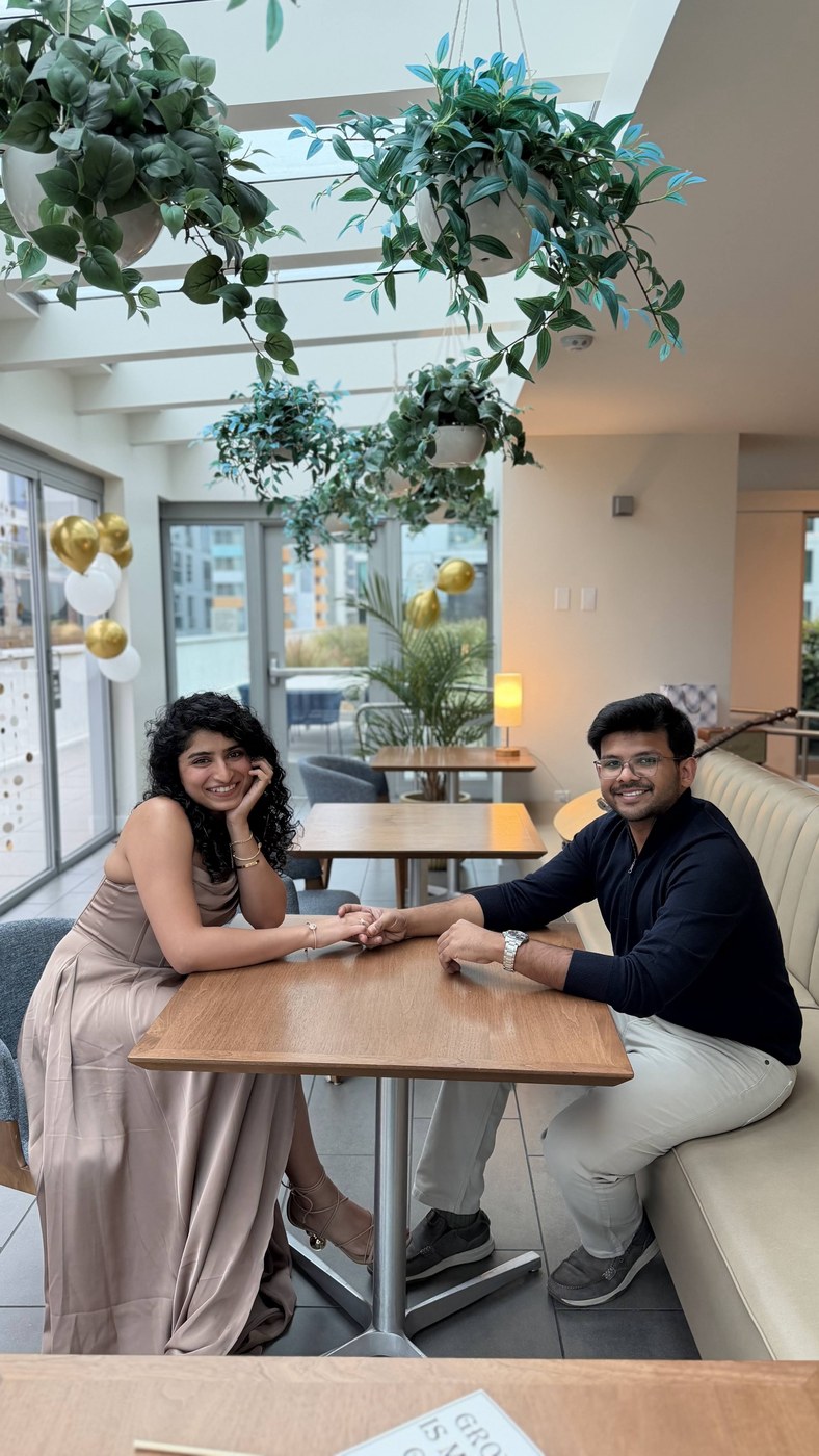 Ananyashree and Piyush holding hands at a cafe
